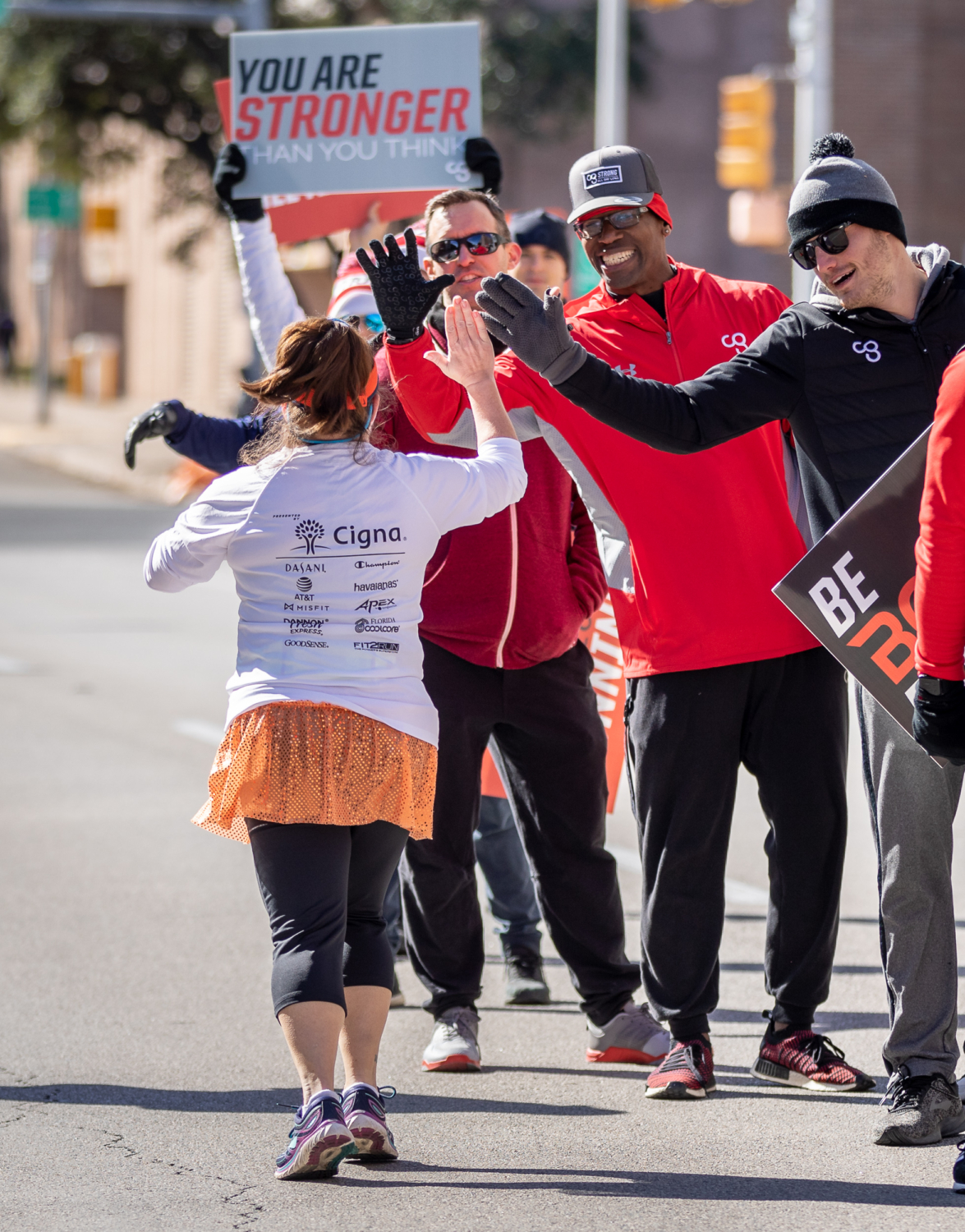 CG trainers cheer on runners at the 2019 3M Half Marathon. Expand your summer training with Camp Gladiator trainers!