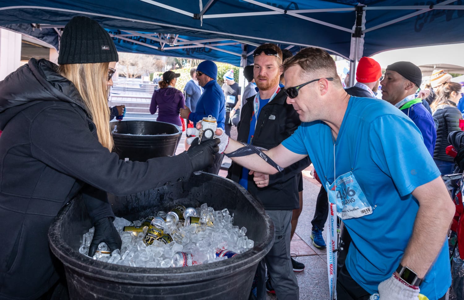 In 2018, runner gets a beer from Oskar Blues, the Official Beer Sponsor of the 3M Half Marathon.
