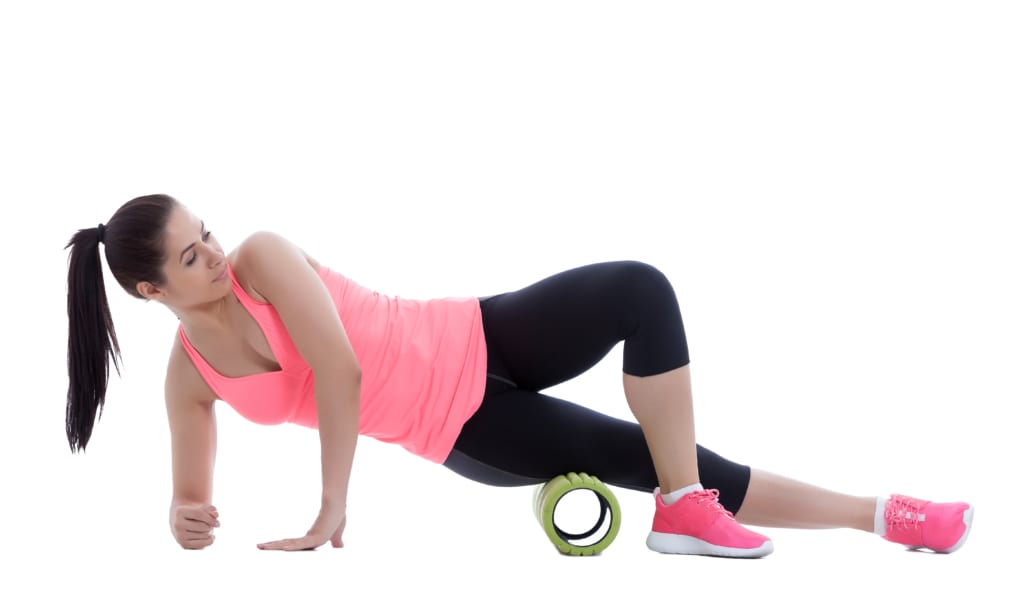 Runner is taking advantage of foam rolling and its benefits.