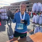 Lauren Dehdari, 2020 3M Half Ambassador, poses at the 2019 3M Half Marathon finish line.