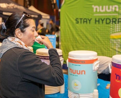 Participant drinks Nuun, the Official Hydration of the 3M Half Marathon.