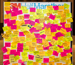 Image of the Post-it Wall from the 2019 3M Half Marathon expo covered in messages of support and inspiration. The Post-it Wall will be a 2020 expo highlight.