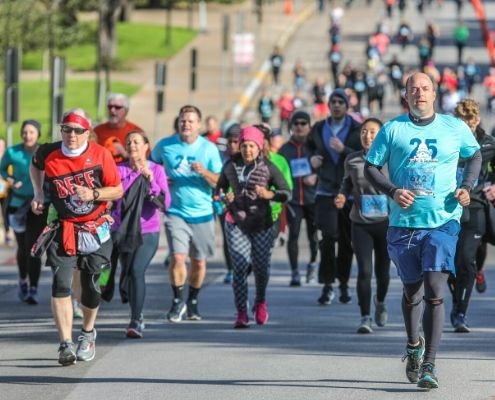 Image of group of runners during the 2019 3M Half Marathon presented by Under Armour. 2020 3M Half Marathon announces the return of Ascension Seton as the Official Medical Provider.