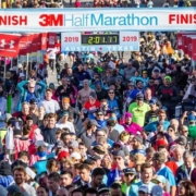 Image of hundreds of finishers crossing the 2019 3M Half Marathon finish line. Read this blog to get everything you need for the 2020 3M Half Marathon.