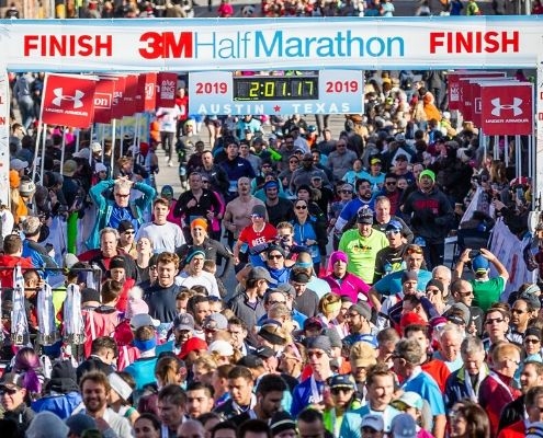 Image of hundreds of finishers crossing the 2019 3M Half Marathon finish line. Read this blog to get everything you need for the 2020 3M Half Marathon.