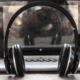 Image of headphones sitting in front of a laptop. Read this blog to learn what the staff at High Five Events would listen to forever.