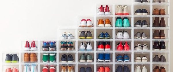 Stacks of space-saving plastic containers are filled with shoes. It's an example of different ways to organize your running shoes. Click on the image's link to visit 3M Half Marathon's Pinterest page for more ideas.