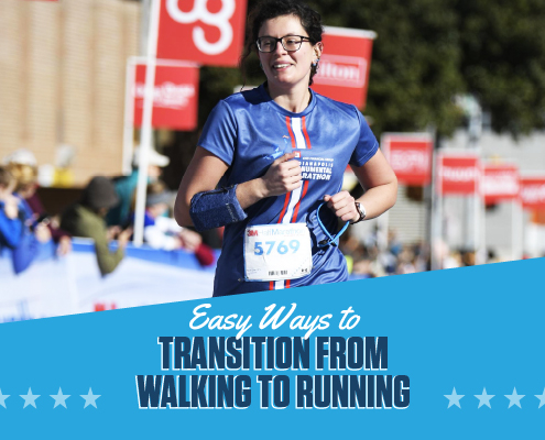 Female runner smiles as she crosses the 2020 3M Half Marathon finish line. Text on design reads Easy Ways to Transition from Walking to Running. Learn more at https://downhilltodowntown.com/transition-from-walking-to-running/
