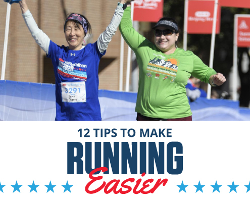 Two female runners cross the 2020 3M Half Marathon finish line with their hands raised in the air. Text in design reads 12 Tips to Make Running Easier. Learn more at http://im8.22e.myftpupload.com/make-running-easier/